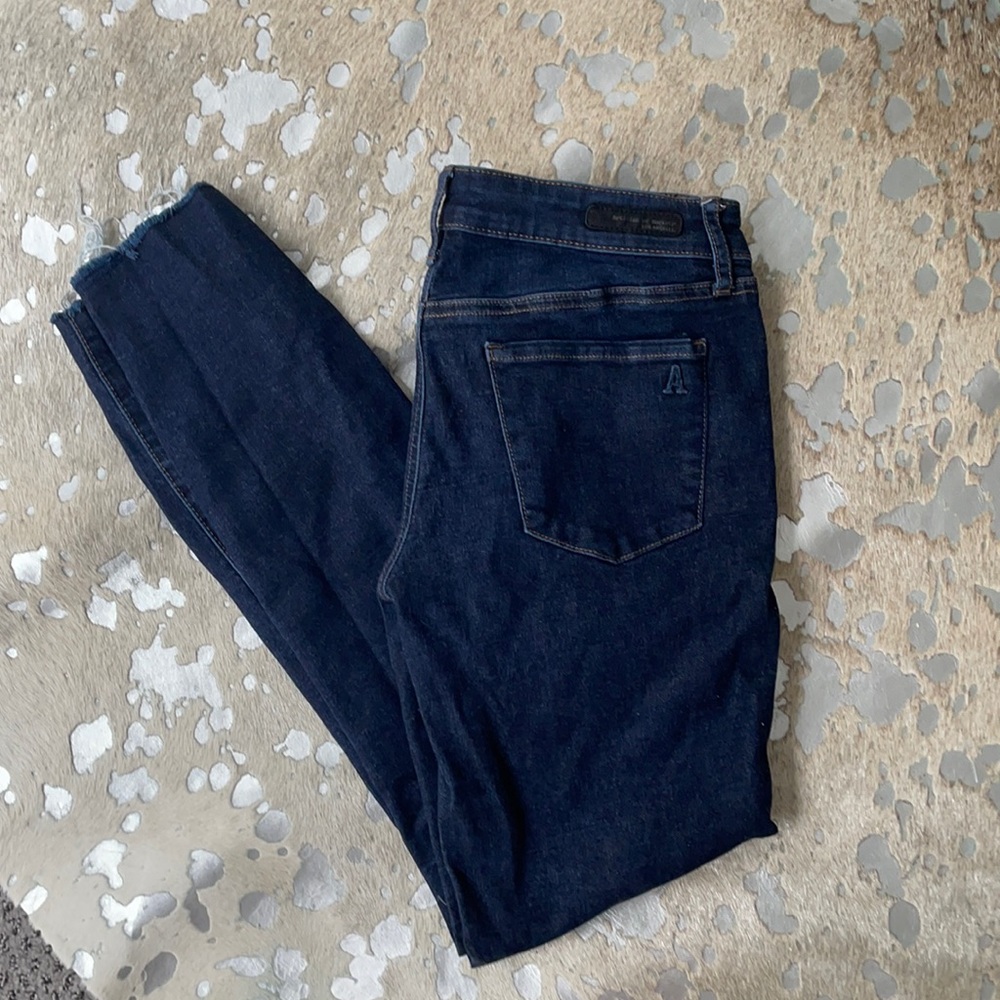 Dark wash frayed hem skinny jeans